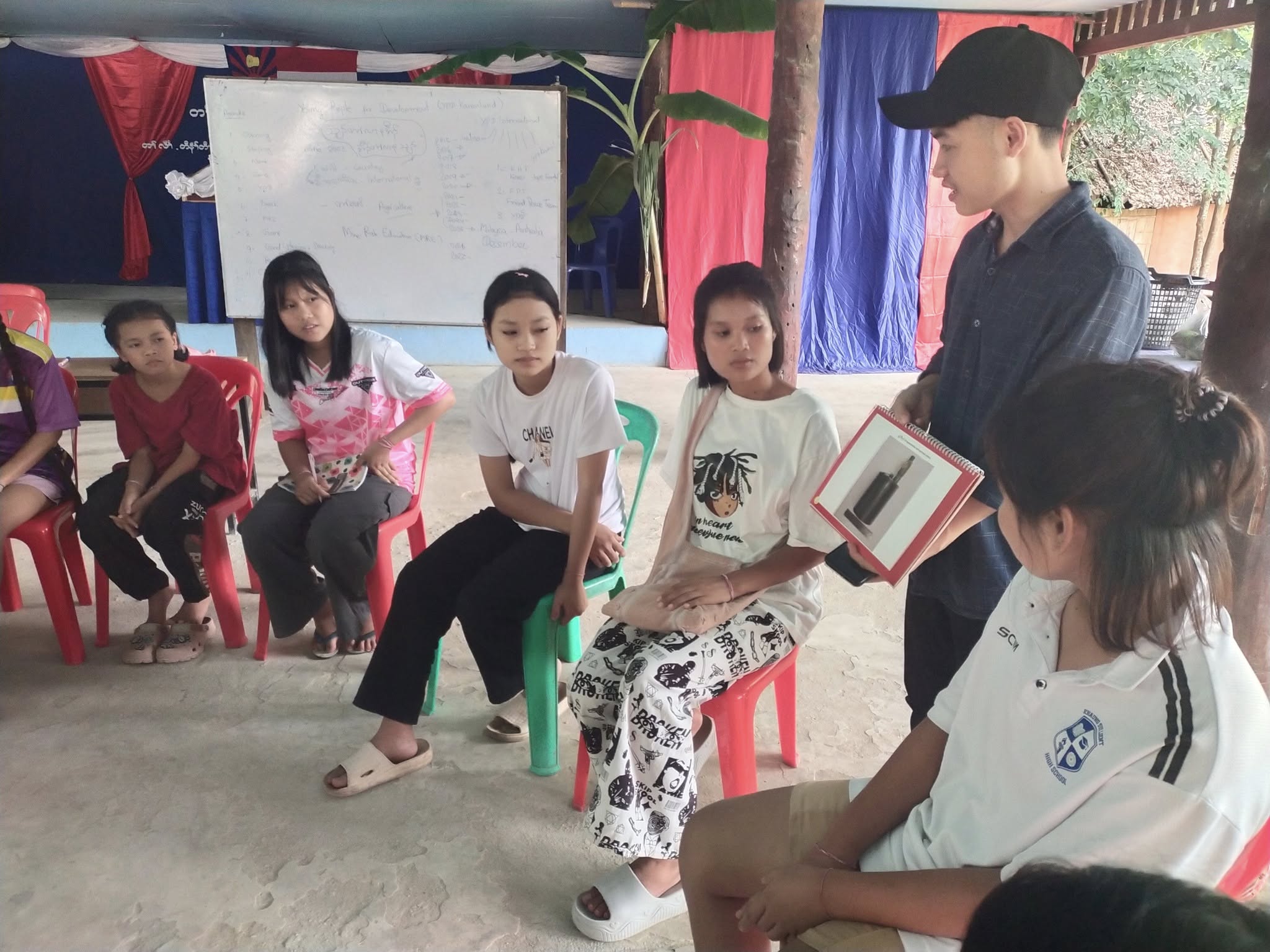 Mentor teaching traditional music to children