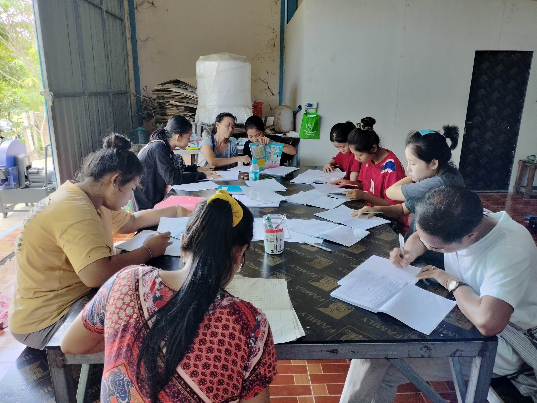 Mentor teaching traditional music to children