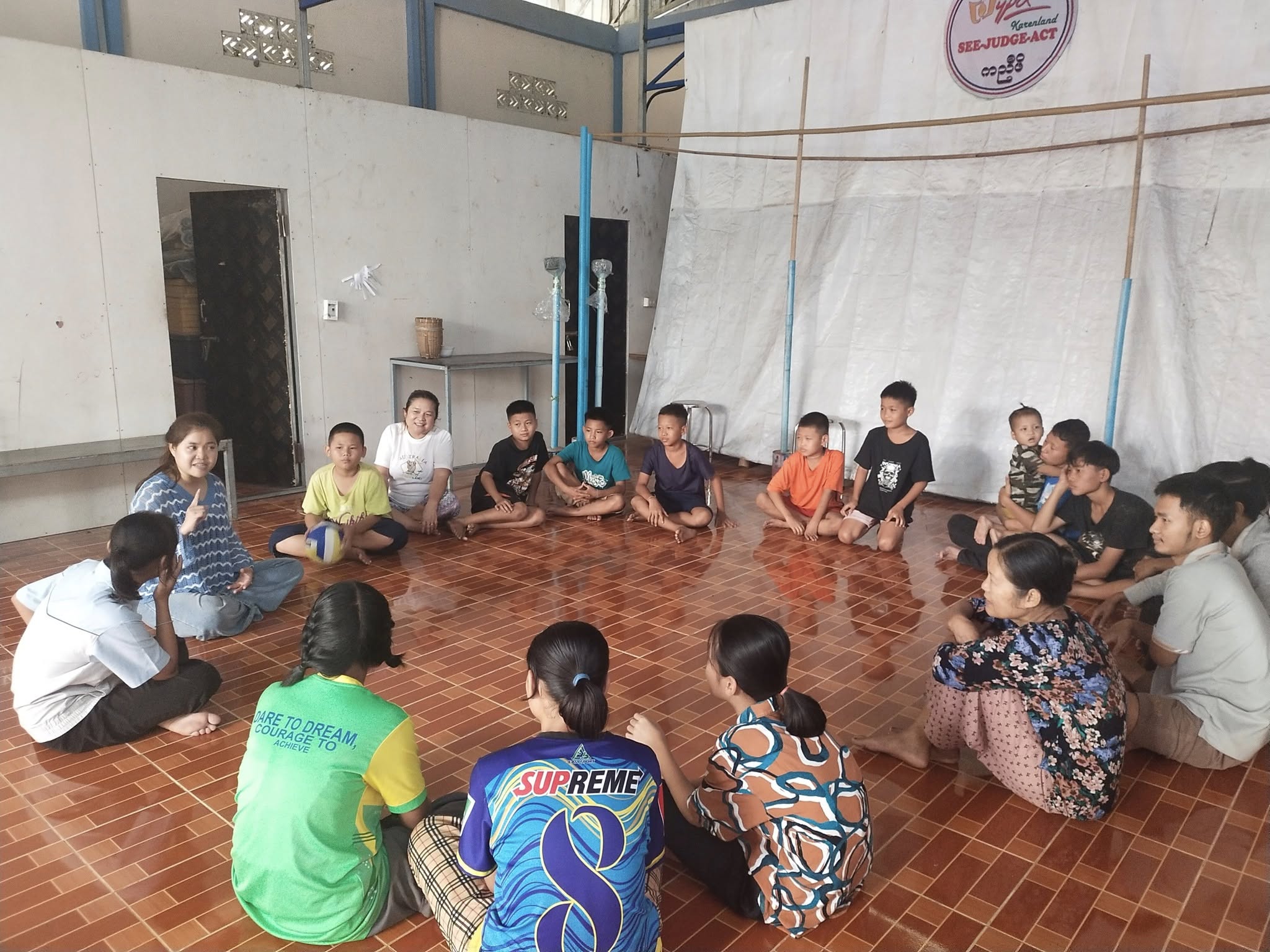 Mentor teaching traditional music to children